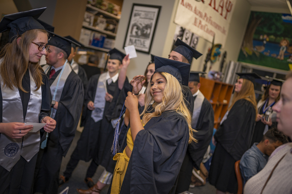 Smiling graduates at the Lavender Graduate Celebration