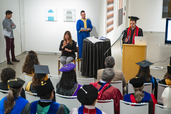 Graduates applaud at the Lavender Graduate Celebration