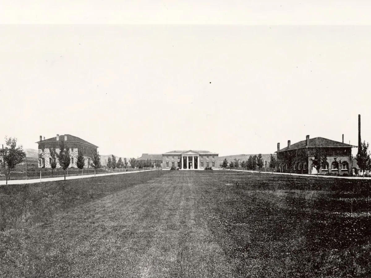 1911 black and white photo that looks north shows the following buildings from left to right: Stewart Hall, Lincoln Hall, Chemistry Building, Mackay School of Mines, Mechanical Building, and the Physics Building.