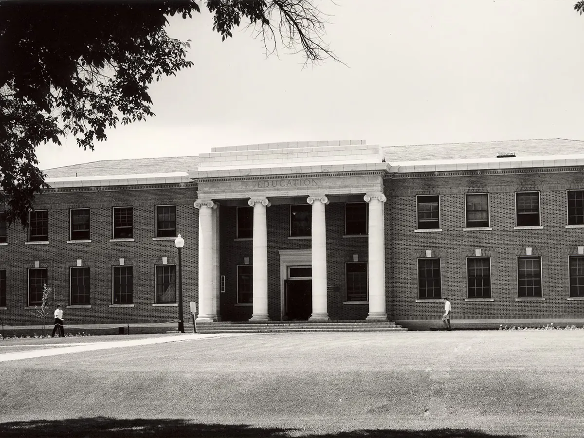 This black and white photo from 1955 shows the front of the Thompson Building on the University of Nevada, Reno campus.