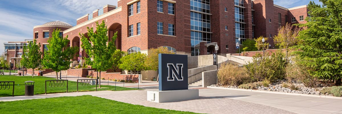 A giant block N concrete logo sits in front of the Mathewson-IGT Knowledge Center on the University of Nevada, Reno campus.