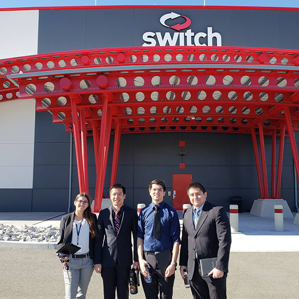 Four students standing outside of Switch during a Wolf Pack shadow visit.