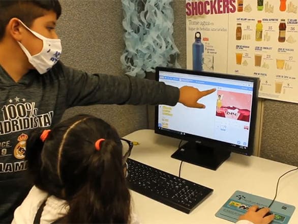 Youth working together to code a digital Mars rover that moves and talks