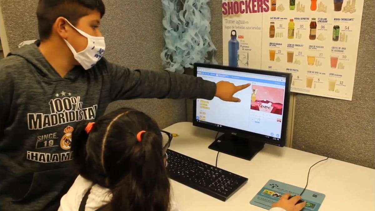 Youth working together to code a digital Mars rover that moves and talks