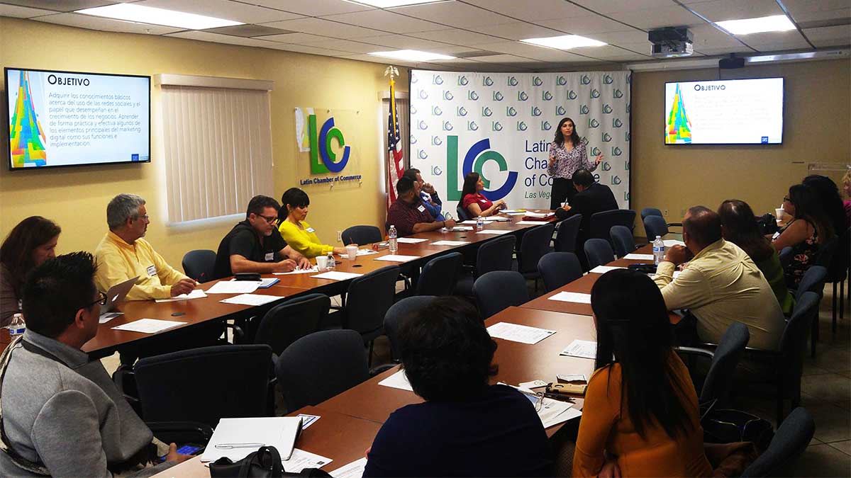 woman teaching a classroom of adults