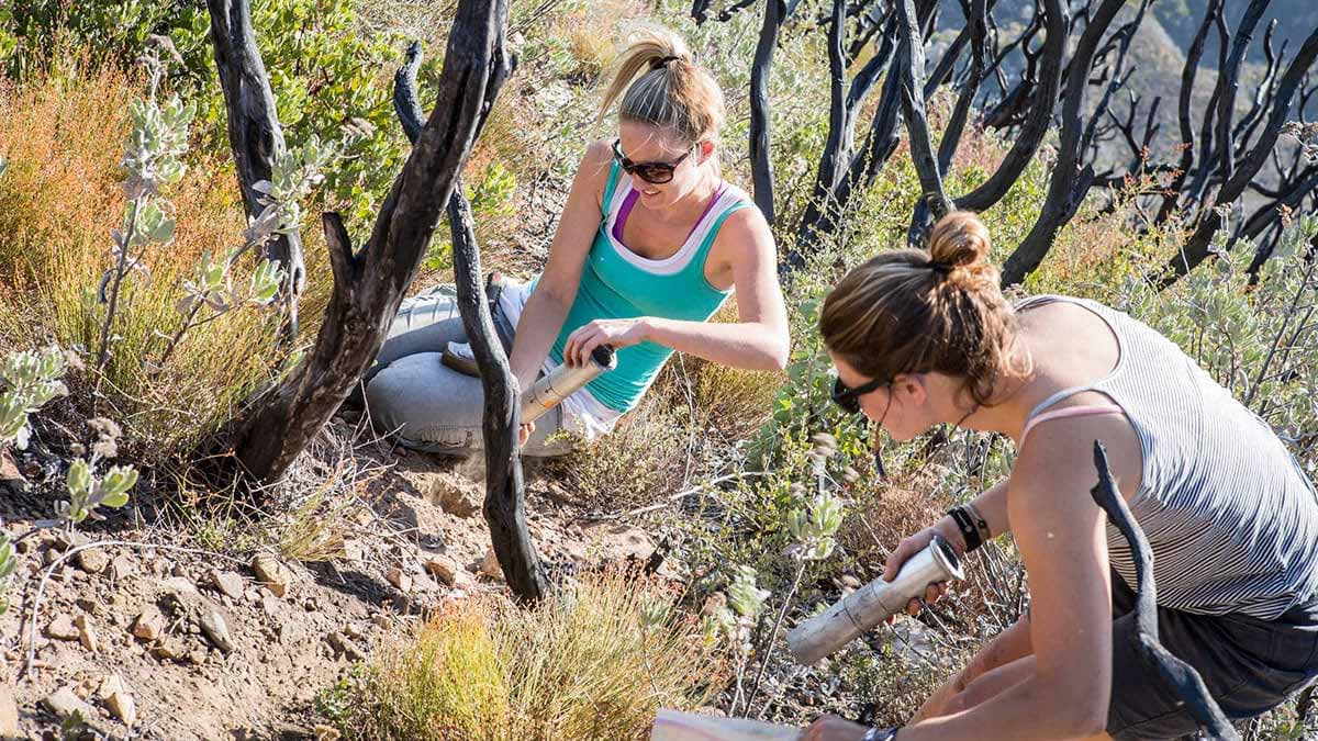 Erin Hanan and student taking soil samples