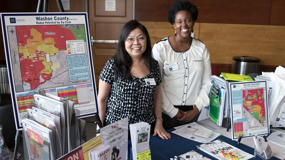 Susan Howe and Nadia Noel at a radon booth