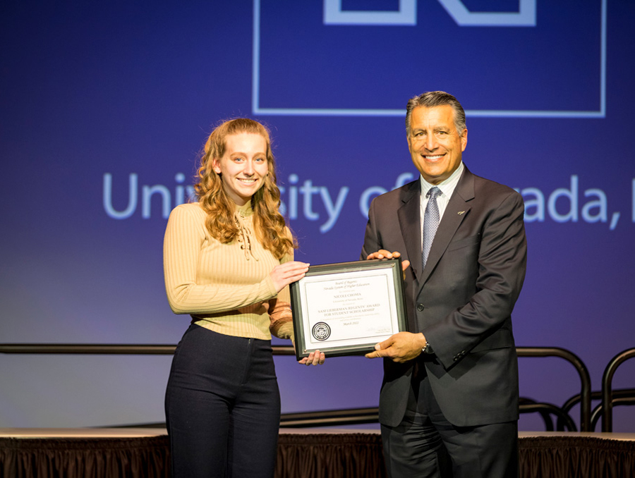 Nicole Choma receiving a Regents' award.