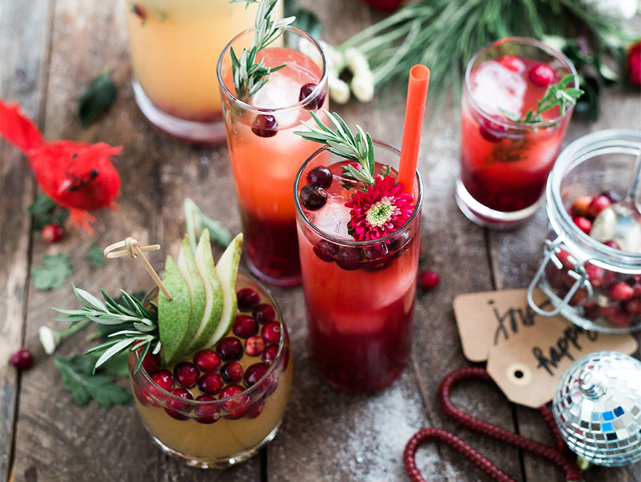 Drinks made with fresh fruit on a table decorated for the holidays