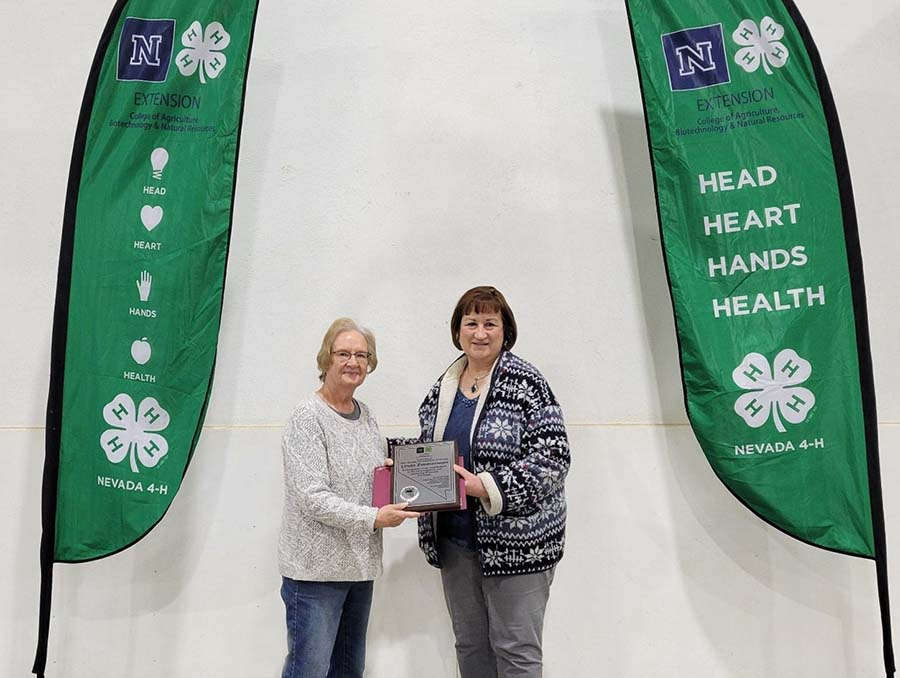 Linda Zimmerman being awarded the 2021 Nevada 4-H Volunteer of the Year by Sue Hoffman.