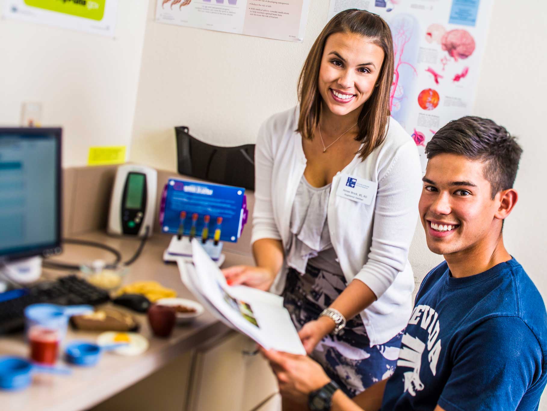 A nutrition professional in her office with a client.