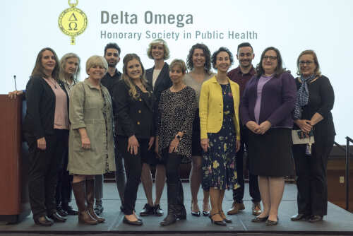 2022 Delta Phi inductees standing on stage