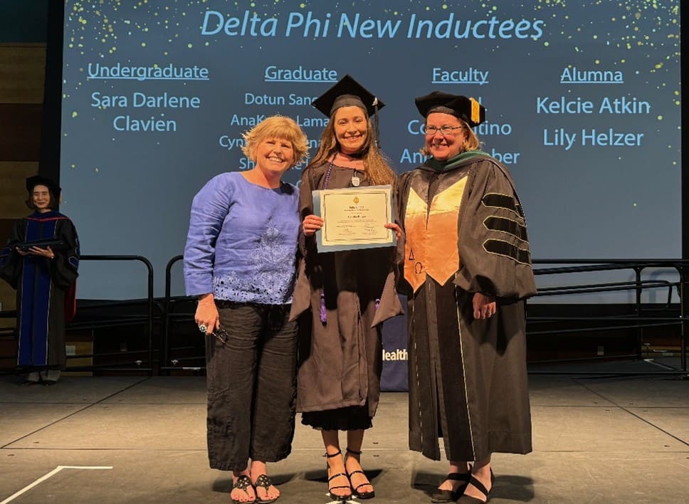 Picture of three delta phi members at 2024 Delta Phi Induction Ceremony