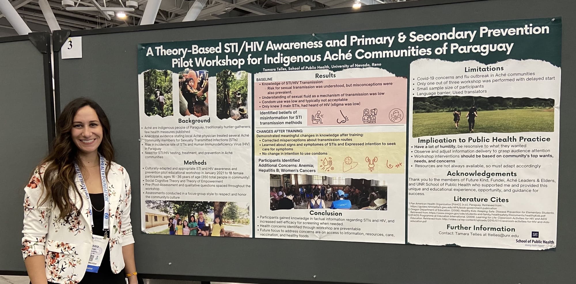 Tamara Telles standing in front of her research poster
