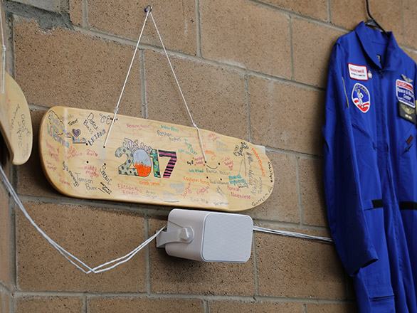 Photo of NASA suit and skateboard