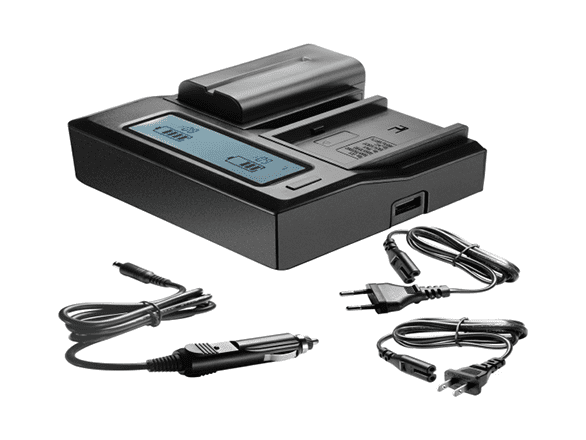 Image of a battery charging in the battery charger. Two black cables are also shown.
