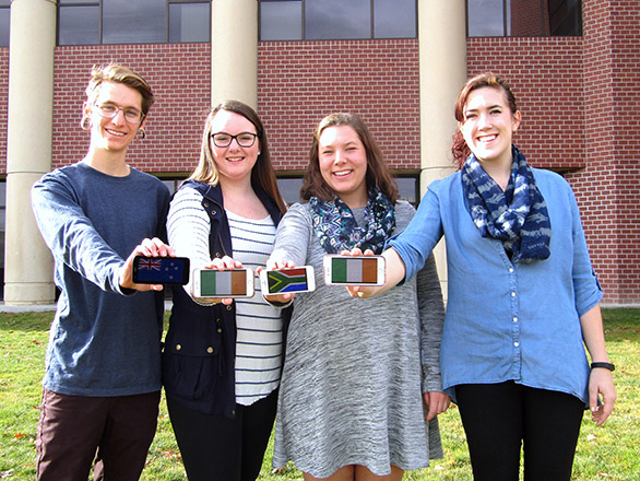 Students holding their phones with flags on them together
