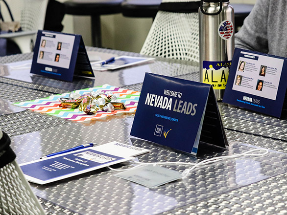 Photo of Nevada Leads brochure on a diamond plate table
