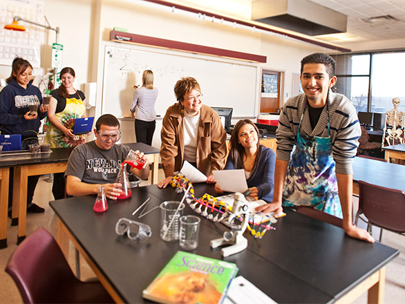 Students and mentor teacher in a science classroom