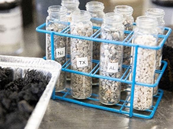 Clear laboratory sample tubes with rocks in them