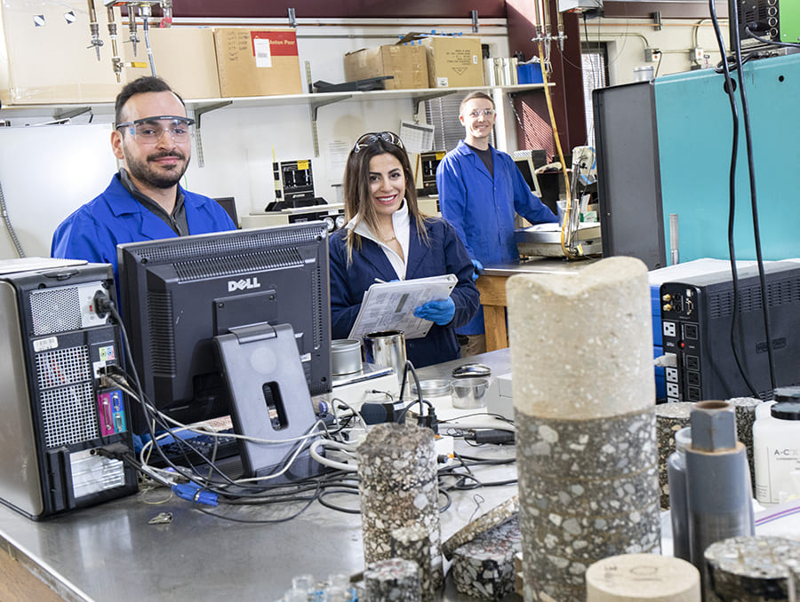 asphalt samples and people in lab coats