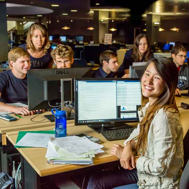 A group of students work on computers in the Knowledge Center