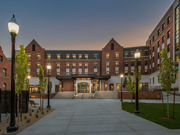 Dusk falls on the exterior courtyard of an illuminated Great Basin Hall on the University of Nevada, Reno campus.