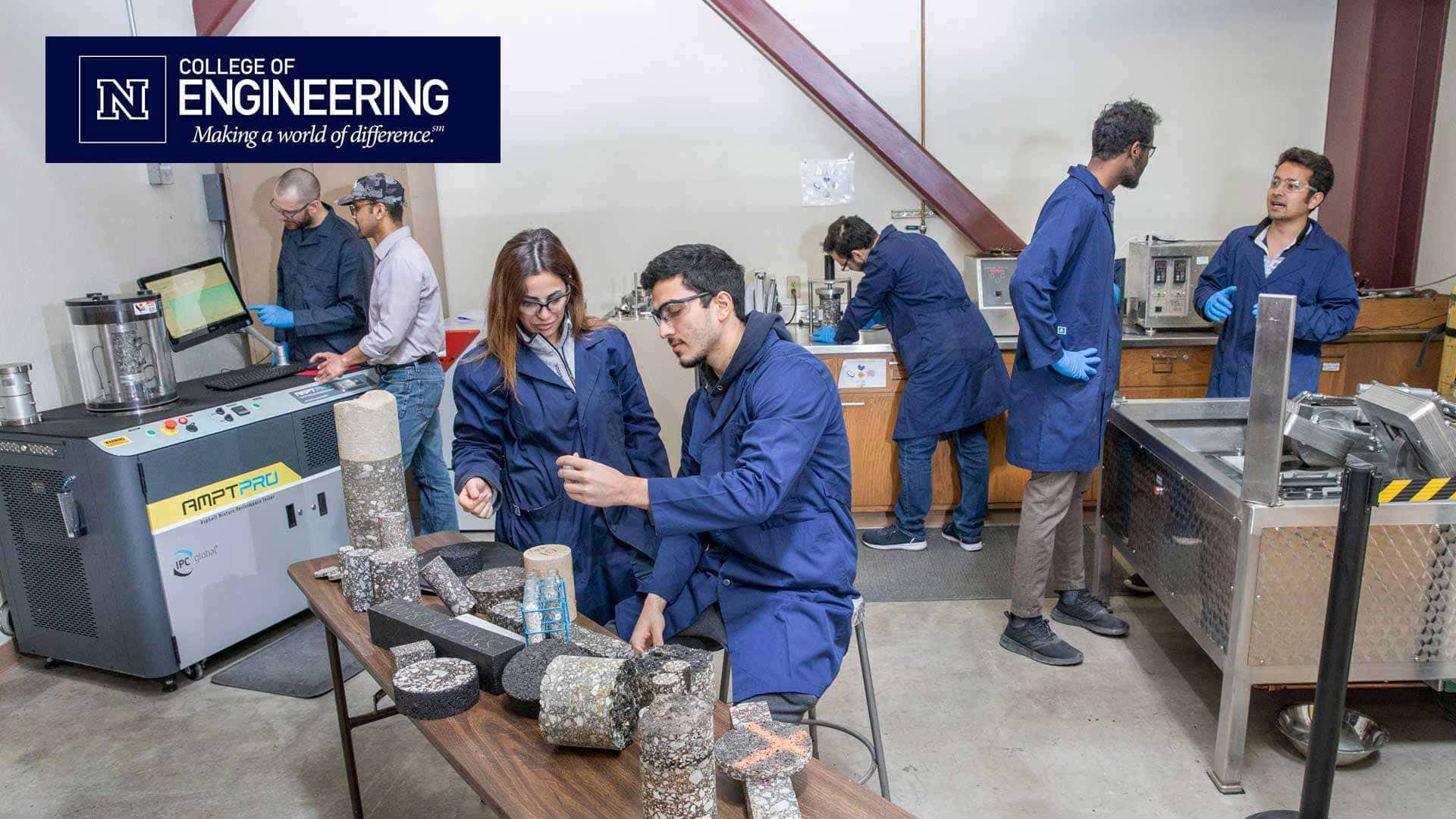 Students in pavements lab with College of Engineering logo