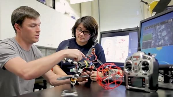 Students working on drone together