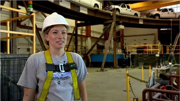 Student with hard hat in earthquake engineering laboratory