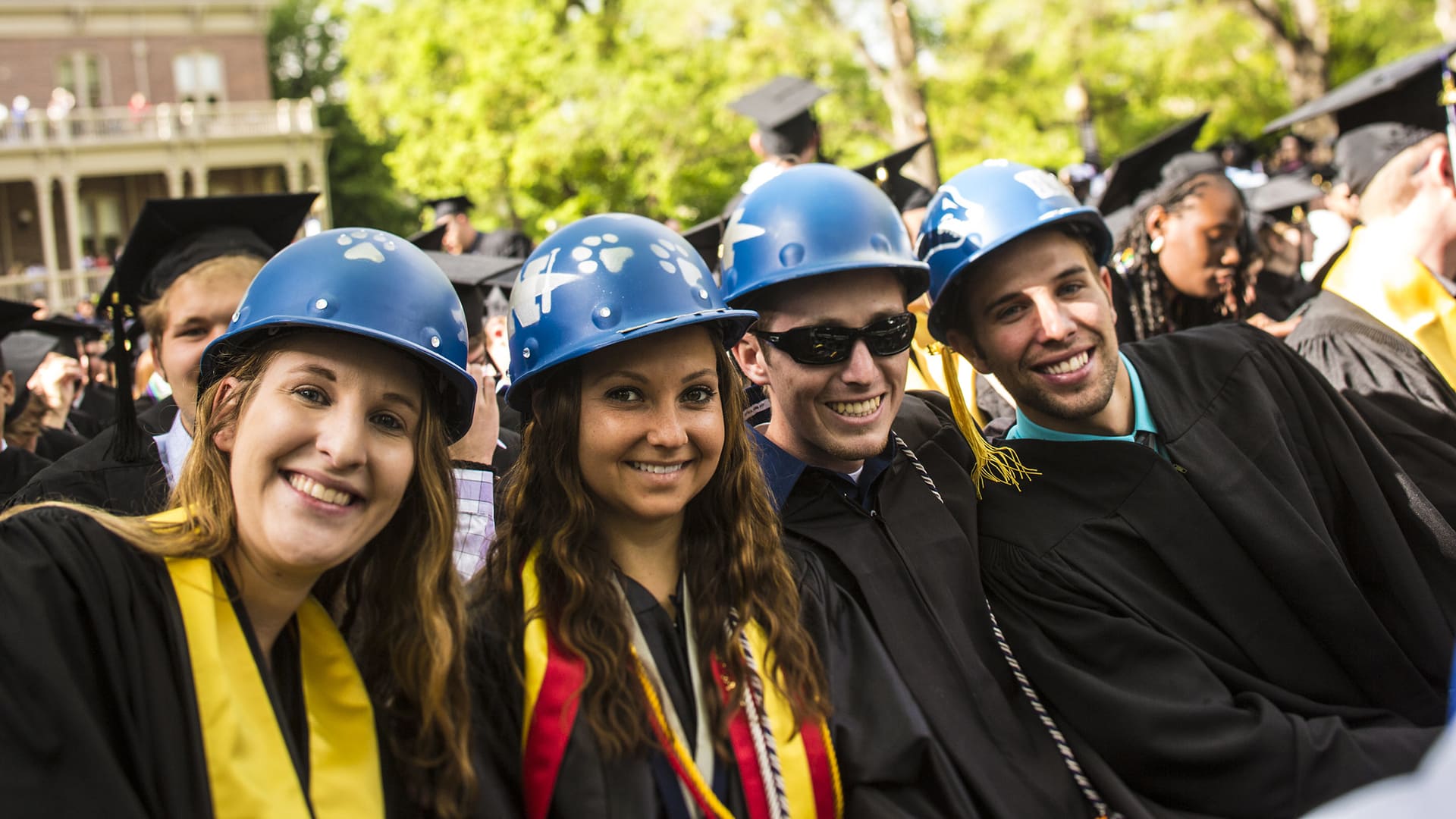 Engineering graduates wearing hard hats at commencement