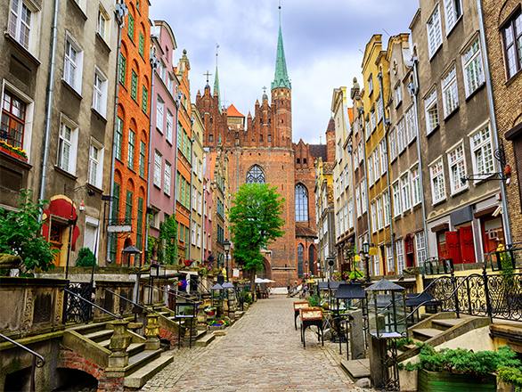 Gothic buildings line a cobblestoned street