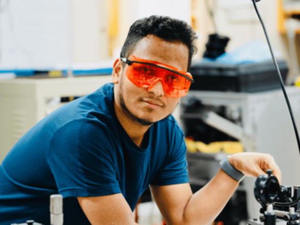 Prakash at an optical bench.