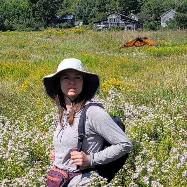 Tara Christensen wearing a climbing helmet.