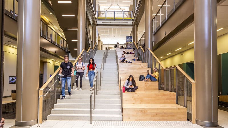 Students walking up the mutliuse staircase in the Pennington Student Achievement Center