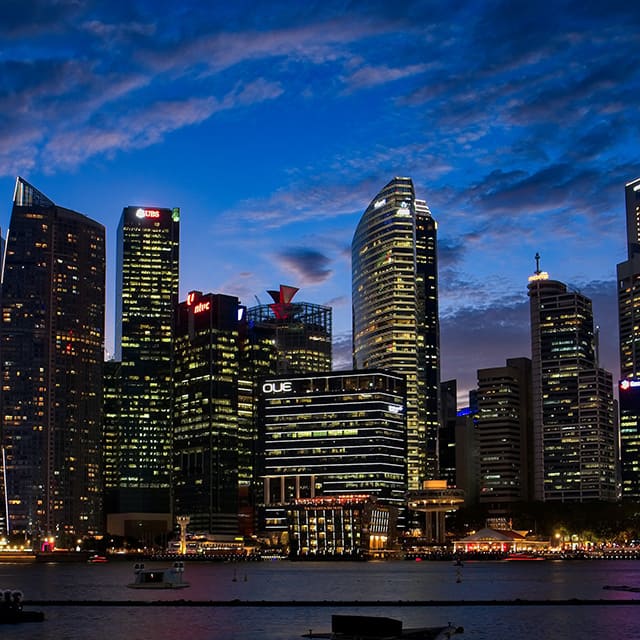 The Singapore city skyline at dusk.