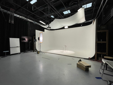 Al Stavitsky stands in the infinity wall, talking to a camera in Studio A.
