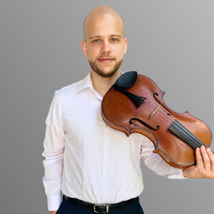 Headshot of Andrew Gonzalez holding a viola