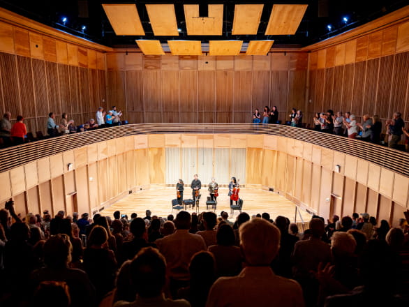 view of Hall Recital Hall with performance on stage and audience