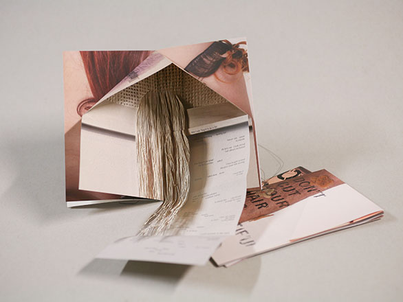 Book art with intricate folds and 3D objects popping out