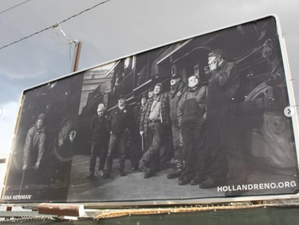 black and white billboard of train works by Anna Newman