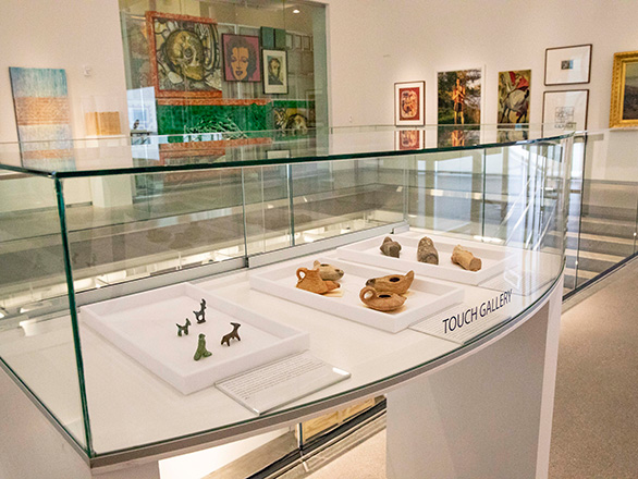 Display case with mini art sculptures