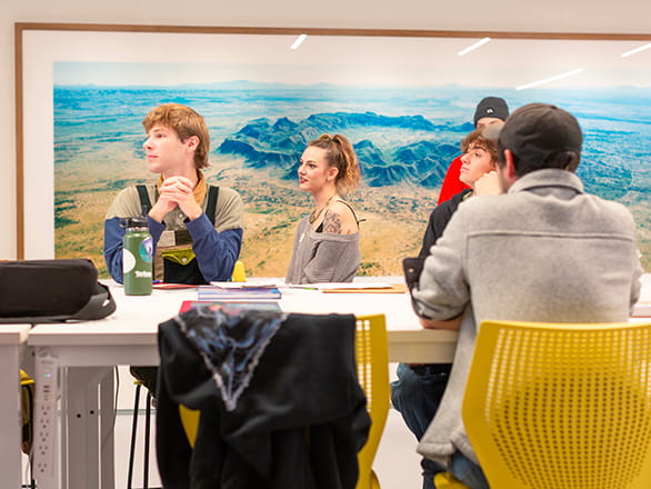 students in classroom studying art