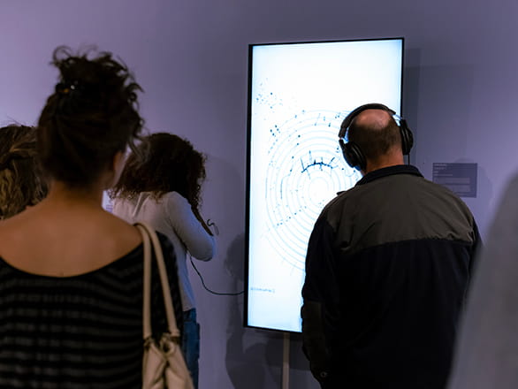 students looking at artwork and taking pictures