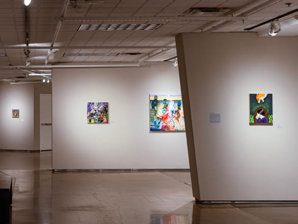view of empty art gallery with artwork on walls