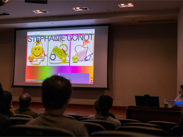 artist giving talk in front of audience