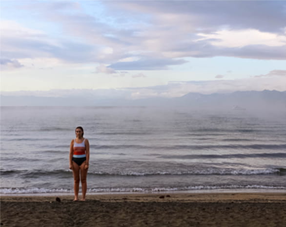 woman standing in front of water