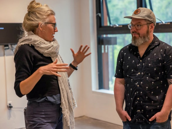 artist giving talk in front of audience