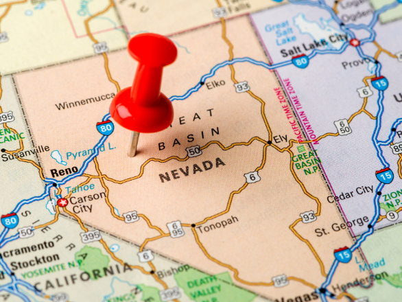 A map of Nevada with a push pin on it.