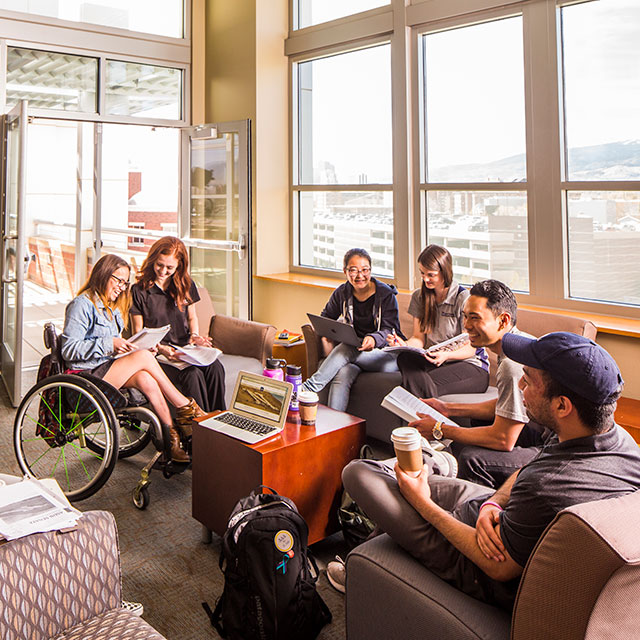 Students sit inside and study together